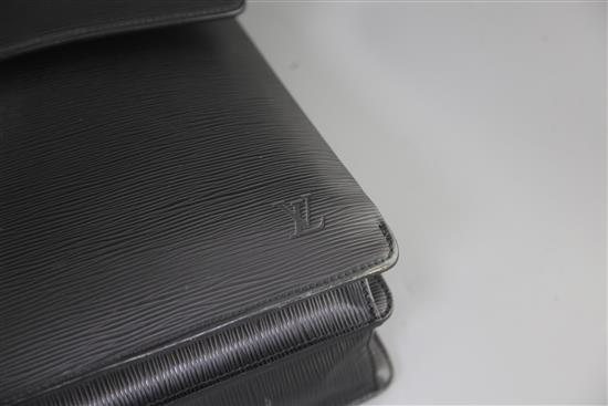 A Louis Vuitton black textured leather attaché case, 16.5in., with slip cover